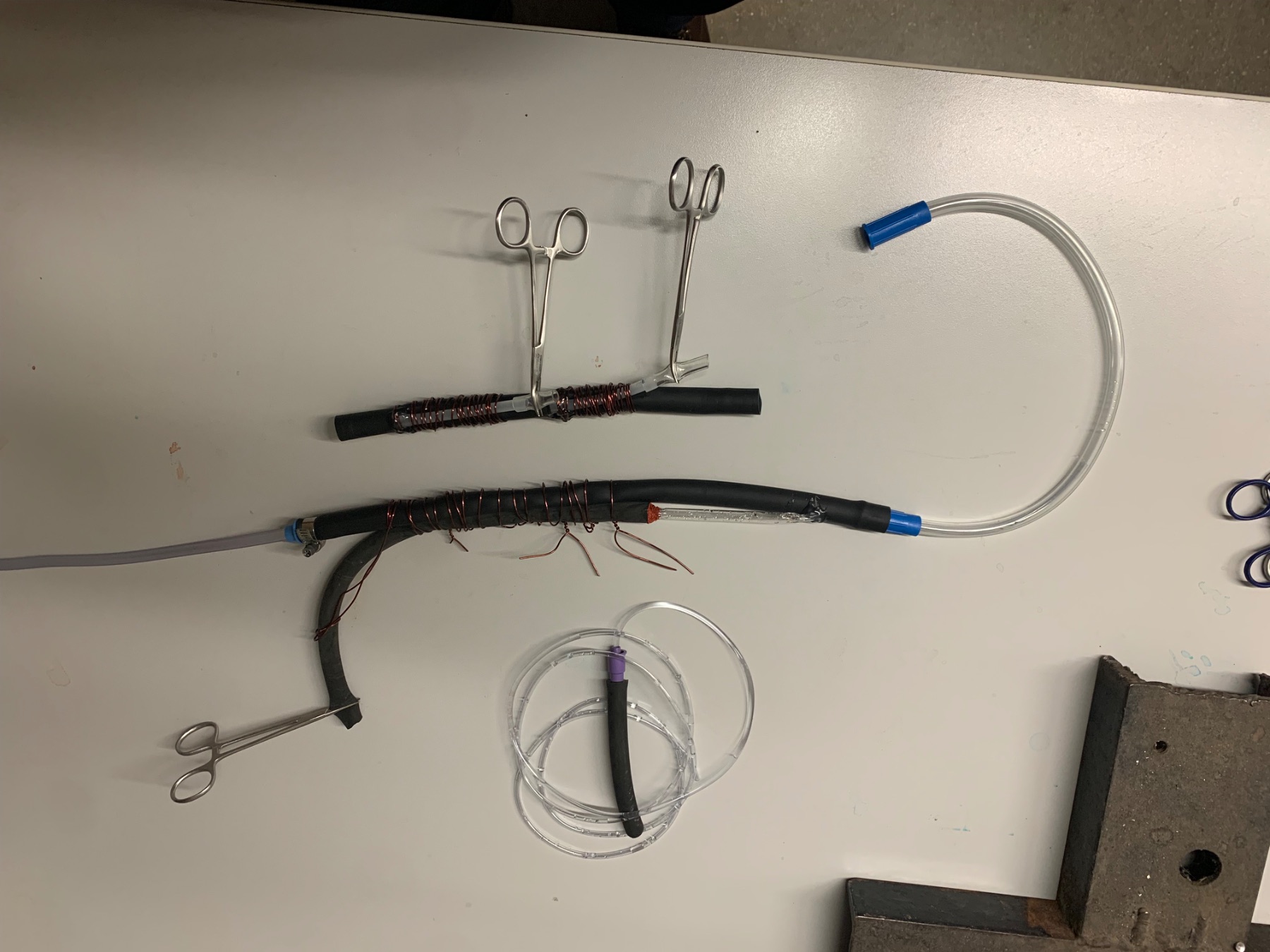 Full test rig — dyed reservoir bags feeding the circulation loop